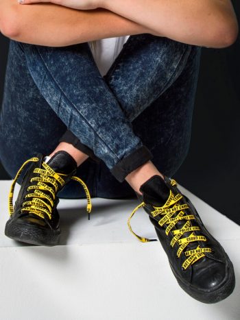 shoelaces yellow police line do not cross